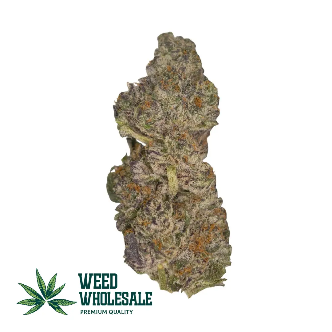Bubba Kush seeded cannabis bud showing dense green flower, orange pistils, and frosty trichome coverage.