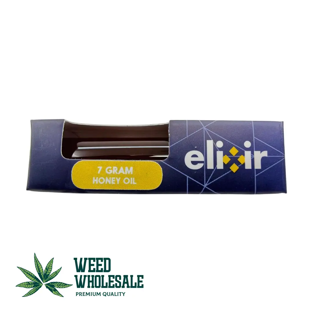 A pack of Elixir Honey Oil – 7G cannabis concentrate featuring smooth golden cannabis oil.